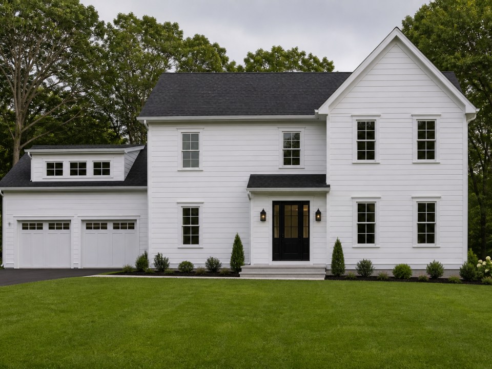 Connecticut home exterior transformation with new siding, roof, windows, and gutters