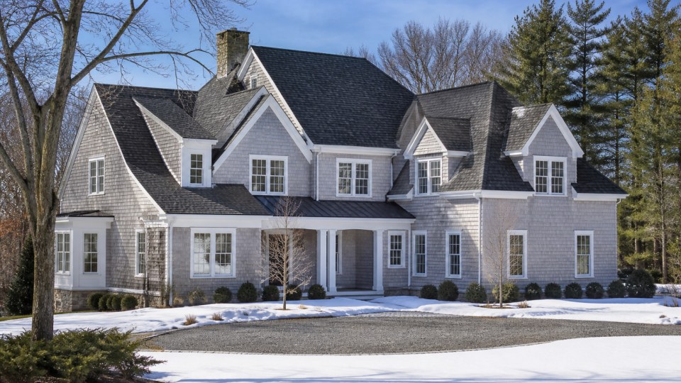 Architectural shingle roof on a Connecticut home in winter