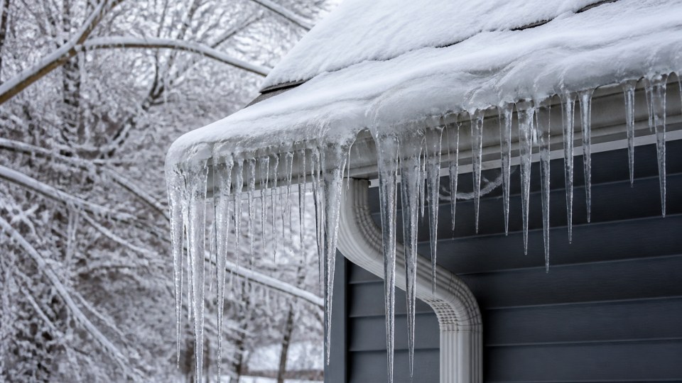 Ice buildup in Connecticut gutters during winter