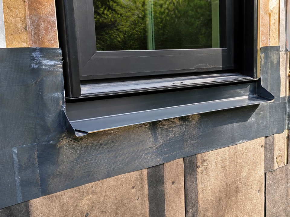 Window sill pan and flashing tape installation