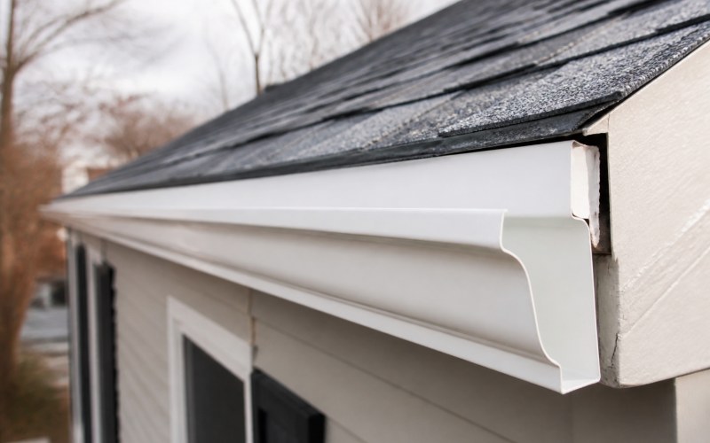 Gutter hanger and replacement detail along roofline