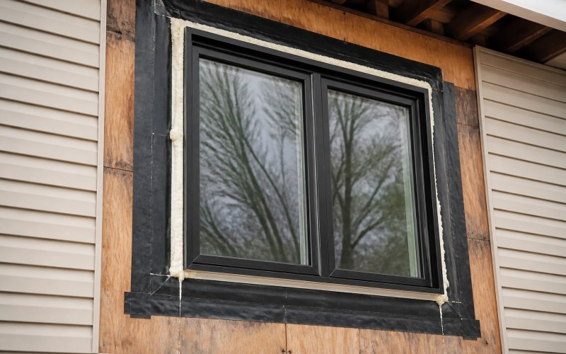 Professional window installation with flashing integration